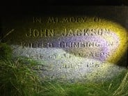 Memorial near the belays of the central climbs at Loudoun Hill. "In memory of John Jackson, killed climbing in the Italian