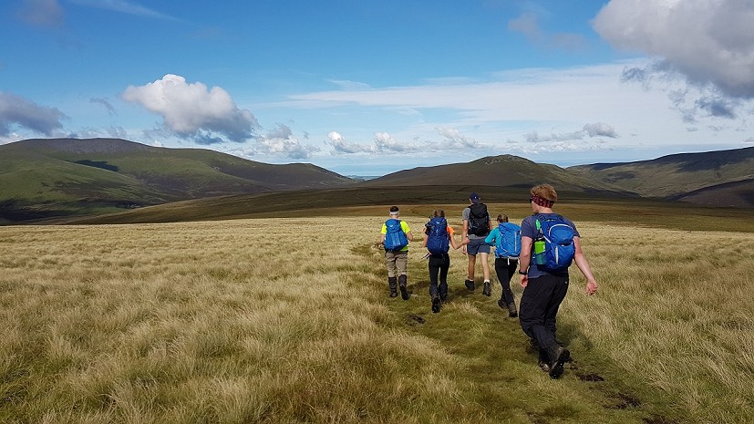 Heading over Mungrisdale Common towards Skiddaw House, with Skiddaw to the left and Great Calva straight ahead  © Rosie Robson