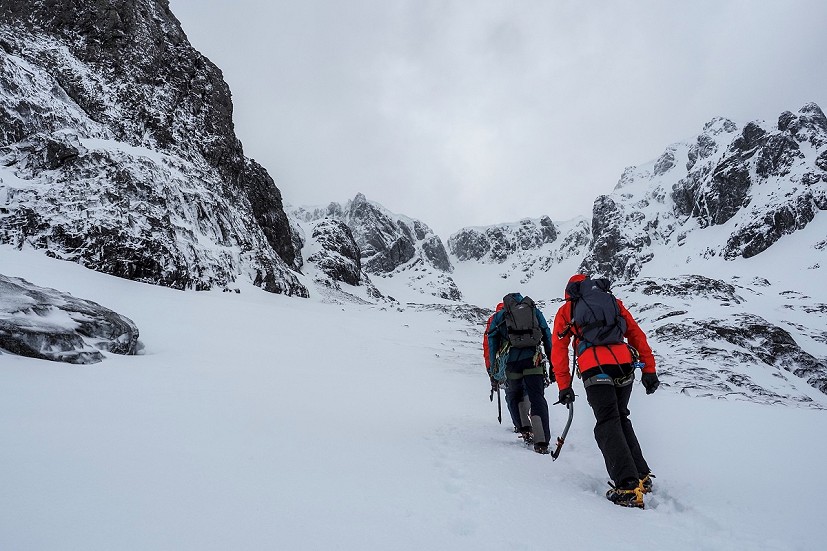 Approaching the Douglas Boulder on Ben Nevis. You can see the shadowy outline of cornices high above us. The snow under our feet looks fairly firm &ndash we aren't sinking. The snow cover isn't uniform, it looks deeper on the left, and shallower just in front of us, where rocks have been exposed (Matt Stygall)  © Matt Stygall
