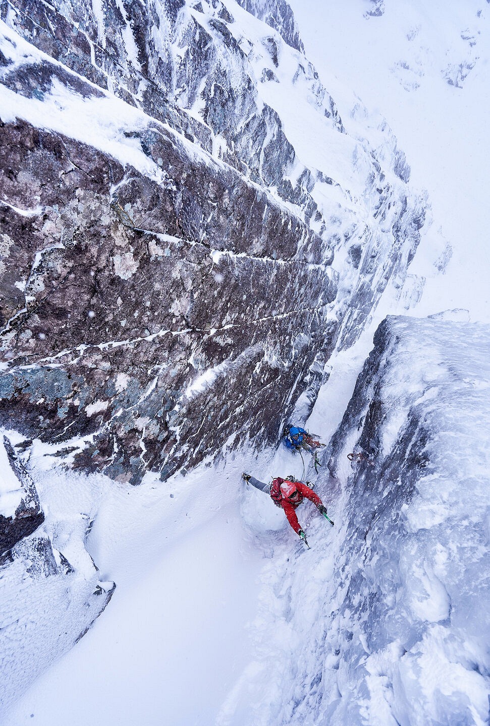 Tom Phillips bridging as high as possible up the second pitch of Minus One Gully, before committing to the steep crux ice wall.  © Hamish Frost