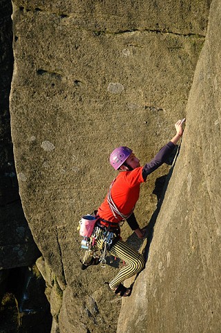 Tom Holloway, wearing his mother's tights, on the crux groove of Long Tall Sally on Burbage North  © Alan James