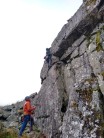 Placing the last piece before clearing the worst of the climb onto a slab. Quite Sutatined climbing