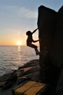 Joe Greening bouldering out at St Bees Head. Catching the last of the sun...