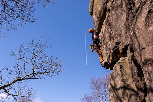 Milo Dixon moving back left on to the face of Moyer's Buttress.   © Ben Clutterbuck