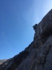 Libby pulling round the bulge on P2 of Time Lord on Indian Slab, Ardgour.