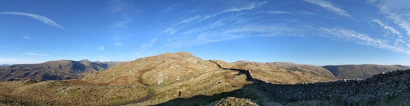 Casting a lonely shadow on the way up Kentmere Pike  © Chris Scaife