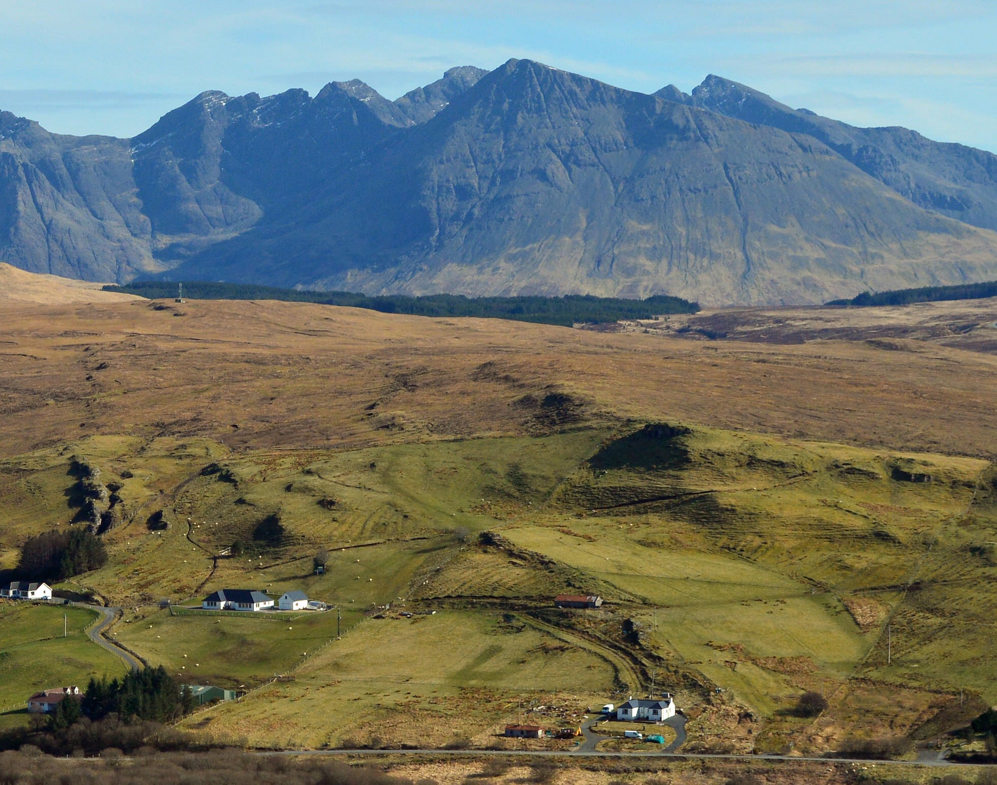 View of house from across the glen with the Black Cuillin Range in the background.  © Removed User