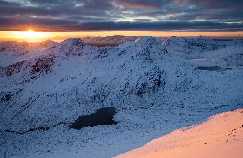 Sunset over the Coulin Forest and distant Skye, from Sgorr Ruadh   © James Roddie
