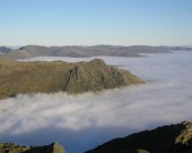 Langdales rising from the fog