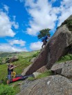 Climbing Oak Right (f5), a highball slab, at Ash Bank boulders (Seathwaite circuit).