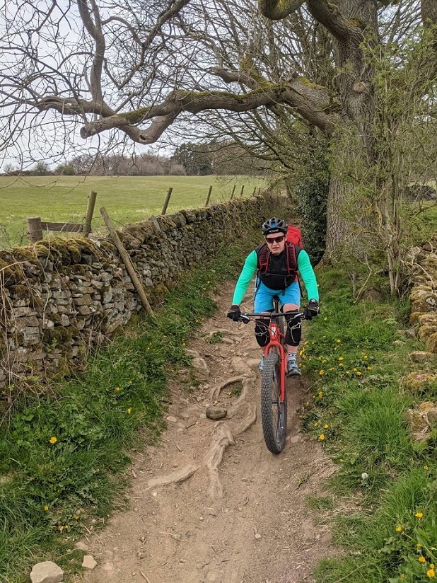 Toby regretting his bike's lack of suspension on the from Riley Graves, Eyam  © Tony Bishopp