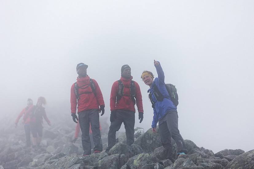 Head guide Keri Wallace explains route ahead which is obscured by low cloud - approaching Carn Mór Dearg (Day 3)   © inov8 - Black Trail Runners - Johny Cook