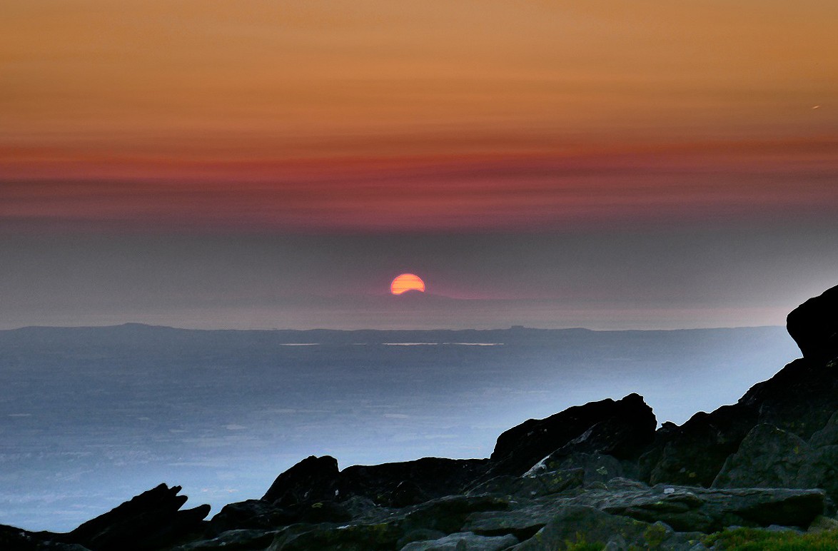 Sunset over the Irish Sea and the distant Mournes from the summit  © Paul Allen