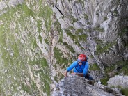 Andy Richards at the top of the slab pitch (p5) Main Wall, Cyrn Las