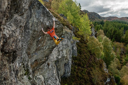 Robbie Phillips cutting loose on the first ascent of his new route 'What we do in the shadows' (E10,7a) at Duntelchaig.  © Michael Cassidy
