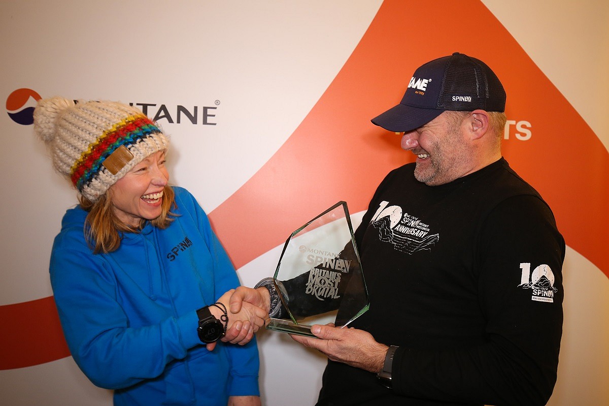 Receiving her well-earned trophy!  © Montane Spine Race