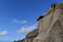 Kyle lewin topping out on Chockstone Crack at Crookrise