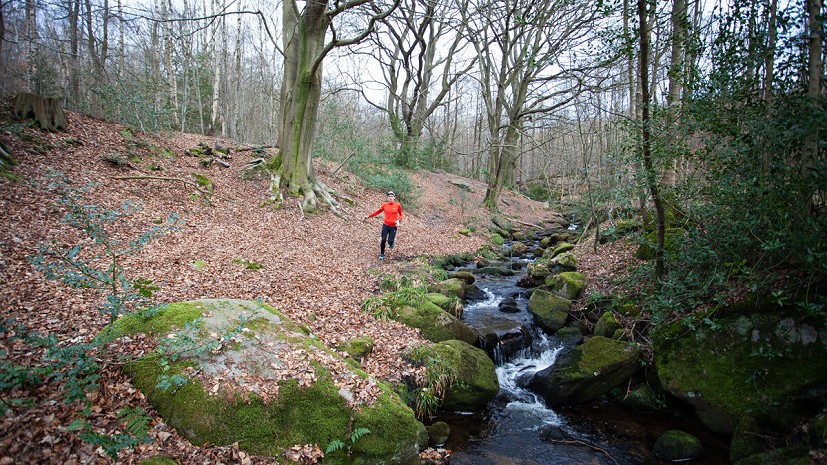 Running through the woods above Grindleford  © UKC Gear