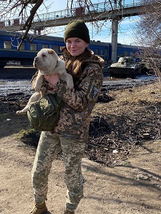 Natalka and her Shar-Pei puppy, Alma, defending their territory.  © 128th 128th Separate Mountain Assault Transcarpathian Brigade.