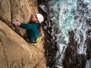 Damien Ma climbing on "Seamless" HVS 5a at Waterfall Rock in Hong Kong