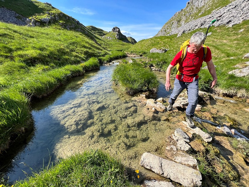 Dolomite Crodarossa keeping feet dry on a stream crossing  © Nick Brown