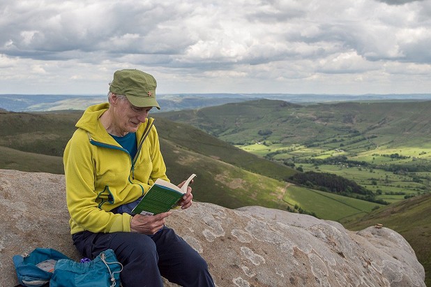 Reading 'Walking Home' on Crowden Tower, Kinder Scout, above an actual (rather than imagined) Edale  © Ronald Turnbull
