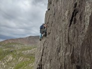 Photo that Karl took of me on main wall arete pitch :-)