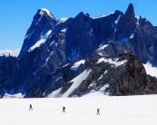 3 unknown climbers crossing the Col du Midi, Dent du Geant in the background
