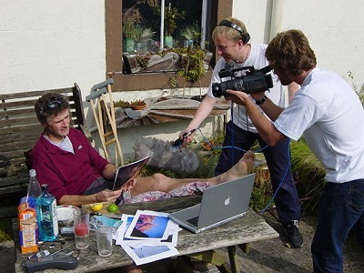 Kevin Thaw fights off the eager hordes re his broken limb. Nice laptop, sir  © Leo Holding