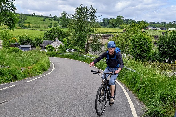 Enjoying the uphill slog on a heavy bike.  © Wesley Cole