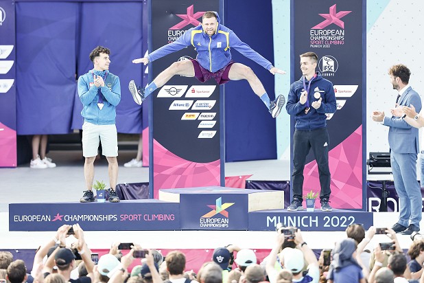 Danyil Boldyrev of Ukraine jumps for joy following an emotional win in Speed.  © Dimitris Tosidis/IFSC