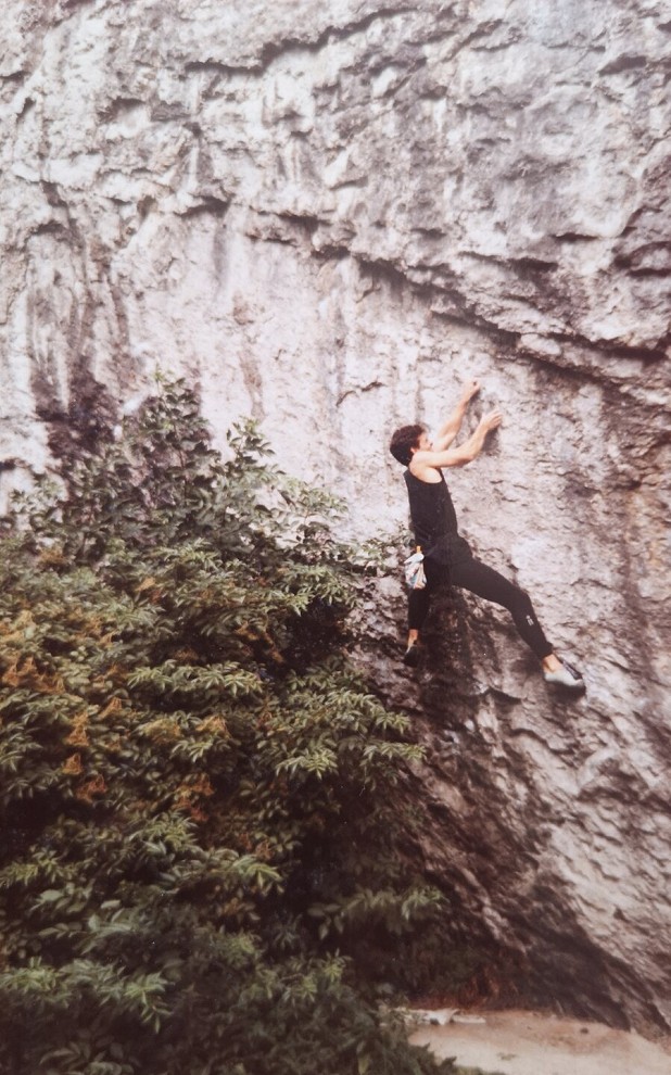 Dad climbing Saline Drip, Raven Tor, 1990  © Millie Mason