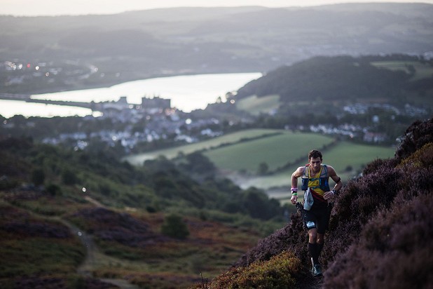 Chris Cope heads into the mountains from Conwy as the sun rises on day one of the Montane Dragons Back Race 2022   © Montane Dragon’s Back Race® | No Limits Photography