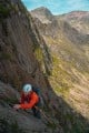 Rob on the starting pitches of Avalanche Wall on a scorching summer's day, with Snowdon in the background.