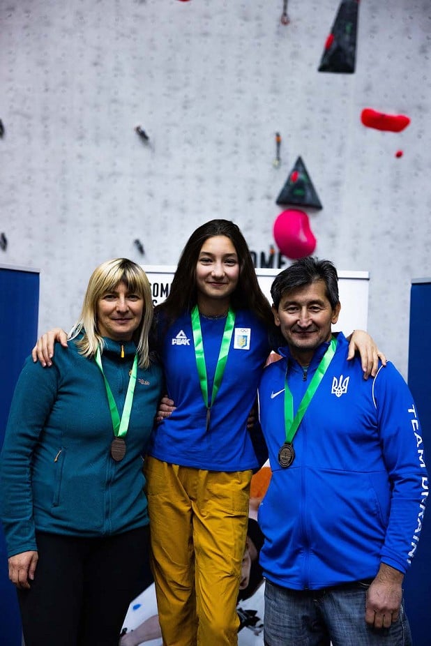 Nataliia and Rafael Kazbekova and Serik Kazbekov show off their trio of gold medals.  © Sam Pratt/GB Climbing