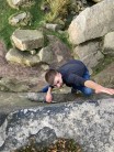 Bouldering on some small rocks at Curbar Edge