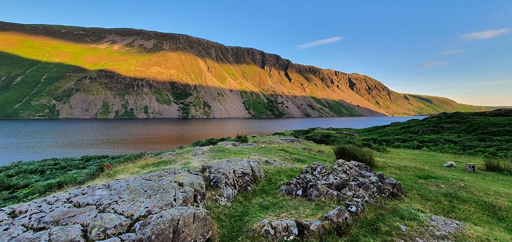 Evening light streaming across the length of the Wastwater Screes  © Norman Hadley