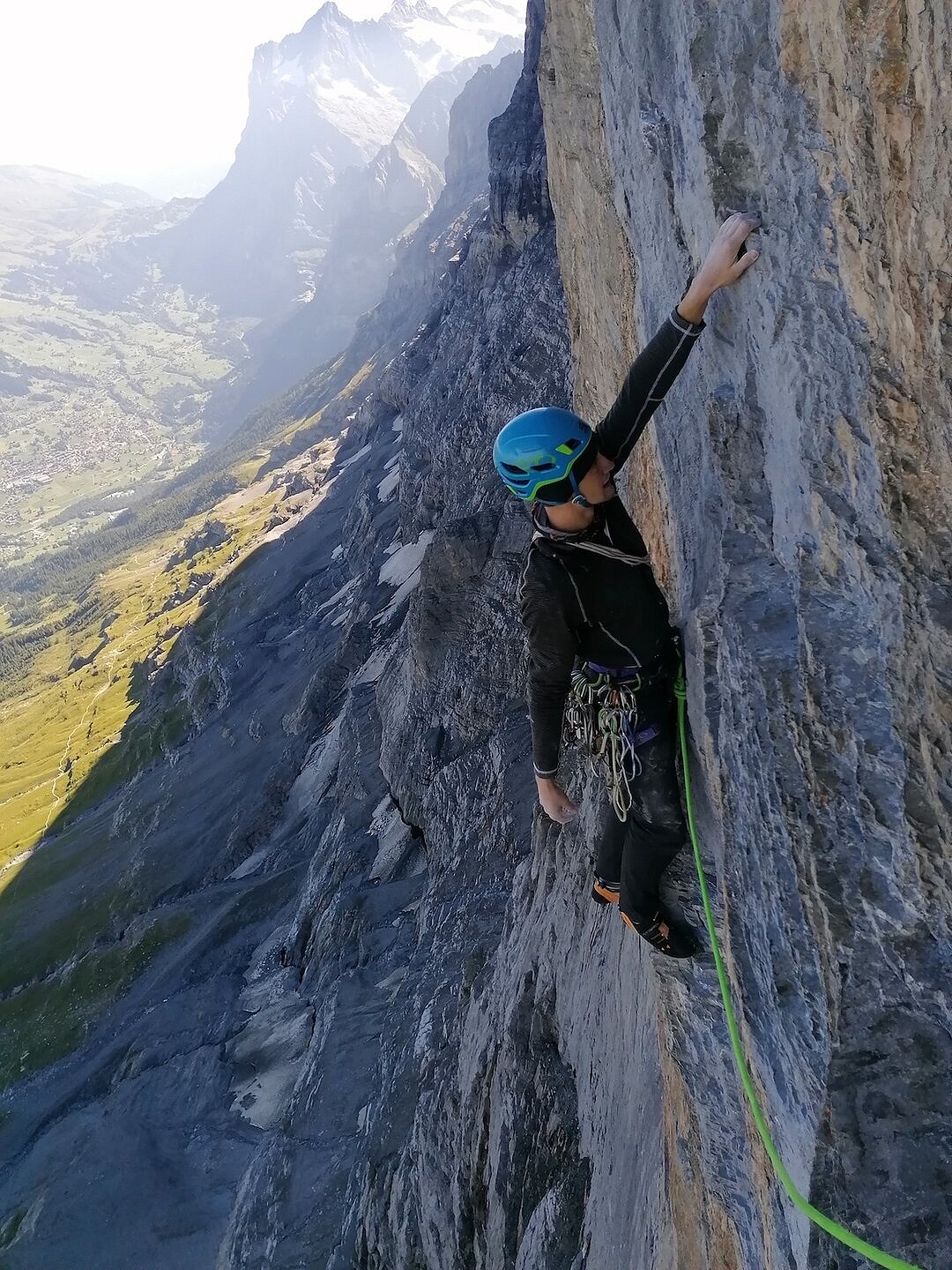 Sebastian shaking out on the first crux (7b+)   © Freja Shannon