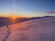 Crossing the Cairngorm plateau at sunrise on the approach to Stag Rocks