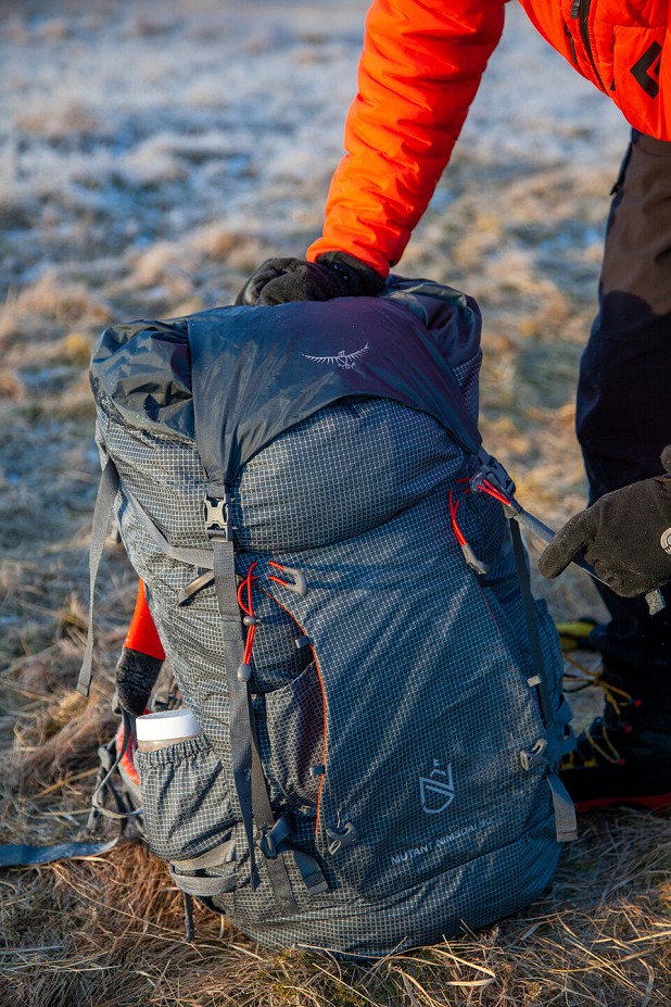 Lid off and flapjacket clipped in to front buckles for heading to a climb from our camp  © UKC Gear