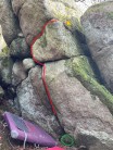 The chockstone (in green), the route (in red) and the finishing jug (yellow triangle) marked out for "Pagan Shmagan"