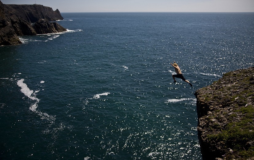 Tim Emmett jumps in after the first solo ascent of Dead Choughed (E6 6b or 7b/S2) at The Castle, Pembrokeshire, in 2008.  © Dave Pickford