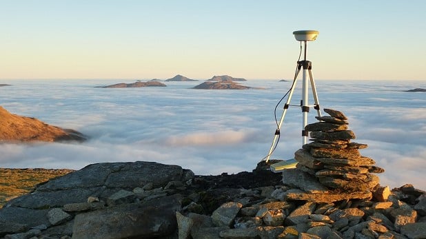 Surveying the summit of Meall Glas (959.3m)  © Alan Dawson