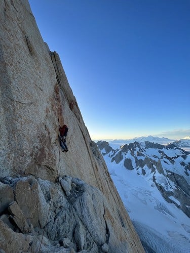 Tyler leading a spectacular dyke pitch towards the bivy ledge at dusk on day two  © Jacob Cook