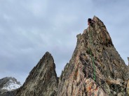 Climbing the knife edge arete of the 4th pointe des Cineastes