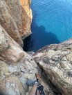 Looking down from the abseil ledge