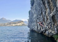 Traversing above the deep blue water of Lake Garda.