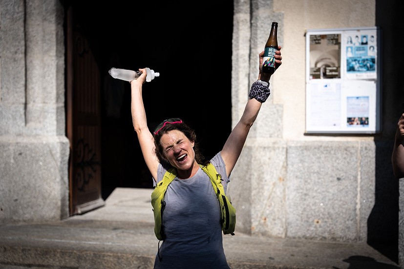 Hilary Gerardi returns from the summit of Mont Blanc to the Chamonix church, beer in hand.  © Toni Spasenoski