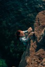 Climber Hope Bawden ascending the deep water solo route 'The Route With No Name' (4c) over crystal clear waters in the Ixtlan A