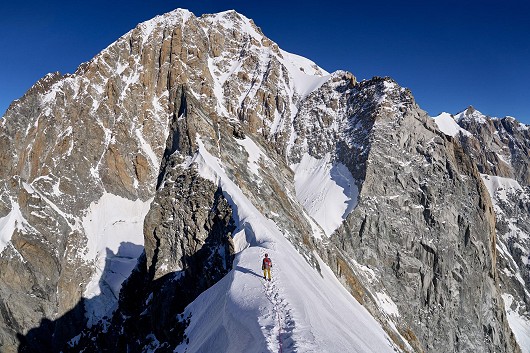 Crossing the Aiguille Blanche de Peuterey with the wild south side of Mont Blanc in front of us  © Hamish Frost